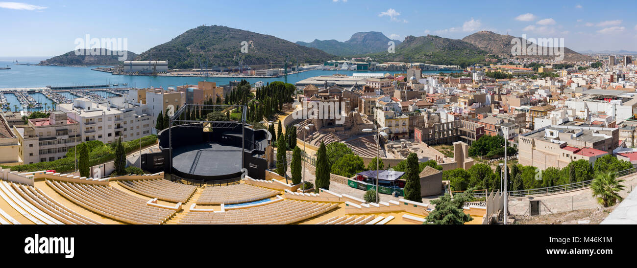 The modern Torres Park Auditorium adjacent to the old Roman Theatre with the port beyond, Cartagena. Spain Stock Photo