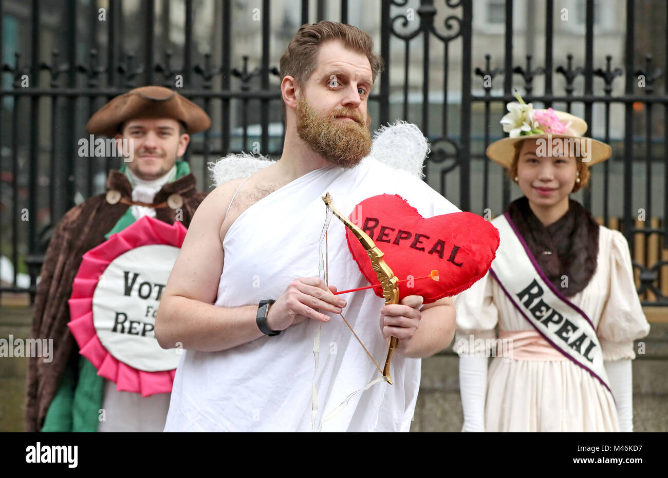 Abortion Rights campaigners, (left to right) Morgan Maher, Adam Murray and Lute Alraad during a protest outside Leinster House in Dublin, which called for a repeal of the 8th Amendment in the Irish Constitution. Stock Photo