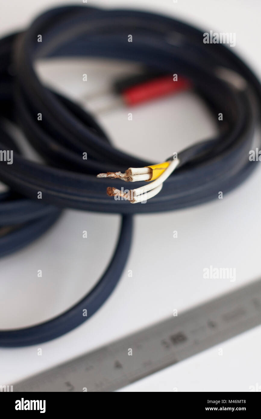 The messily soldered ends of high end audio loudspeaker cable Stock Photo