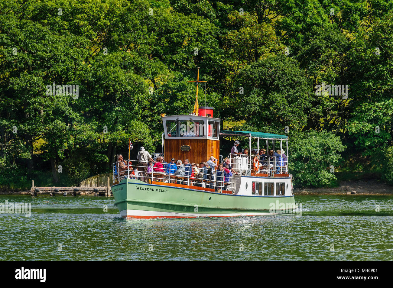 Ullswater Cumbria North West England. The steamer Western Belle leaving Howtown pier. Stock Photo