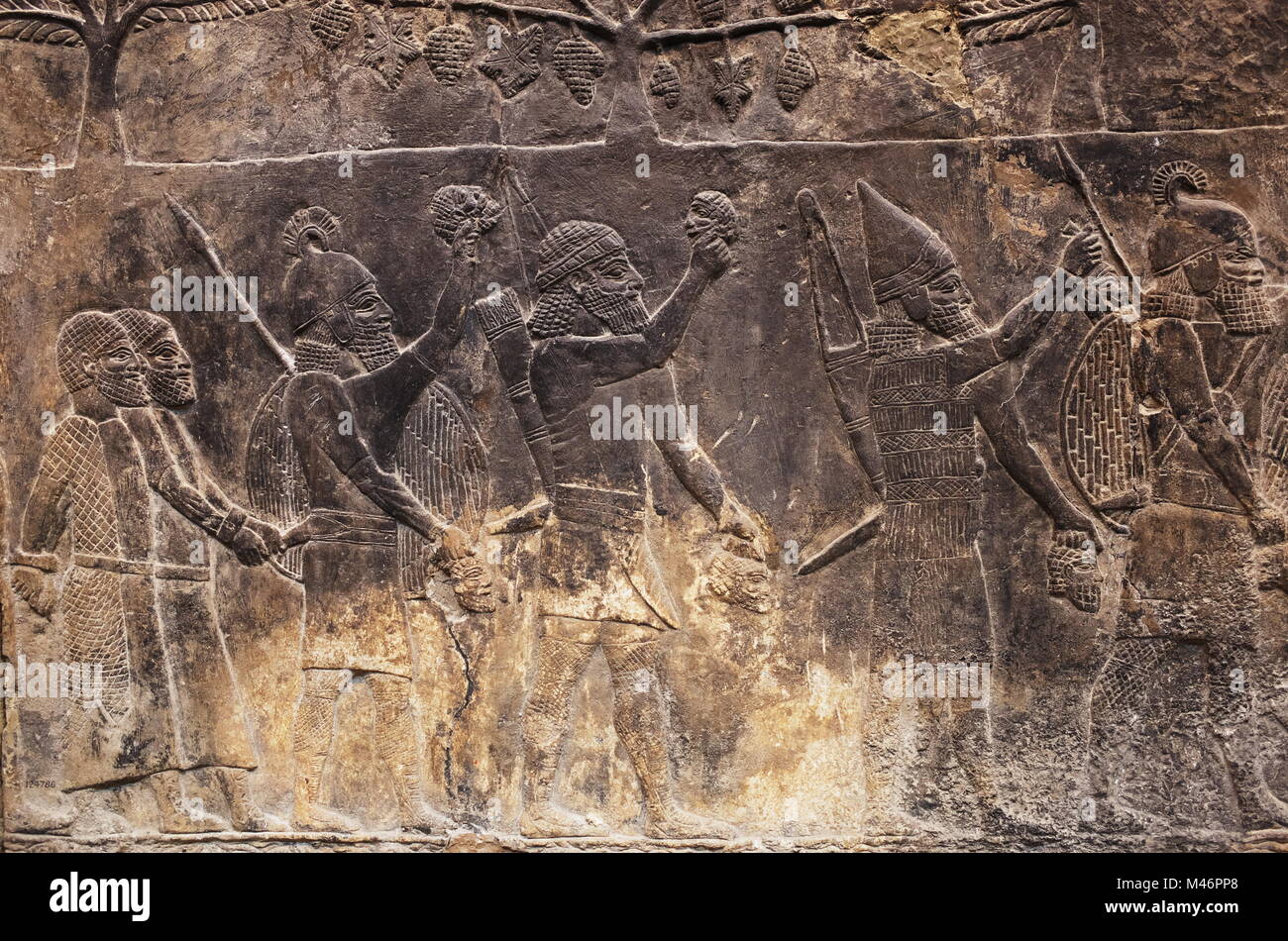 Assyrian wall art relief at the British Museum, London, England, UK ...