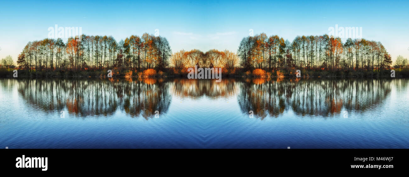 picturesque reflection of trees in a river Stock Photo - Alamy