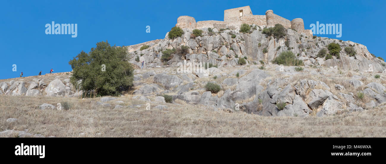 Visitors climbing steep stairs the Castle of Belmez, Cordoba, Spain. Shot made from the hill side Stock Photo