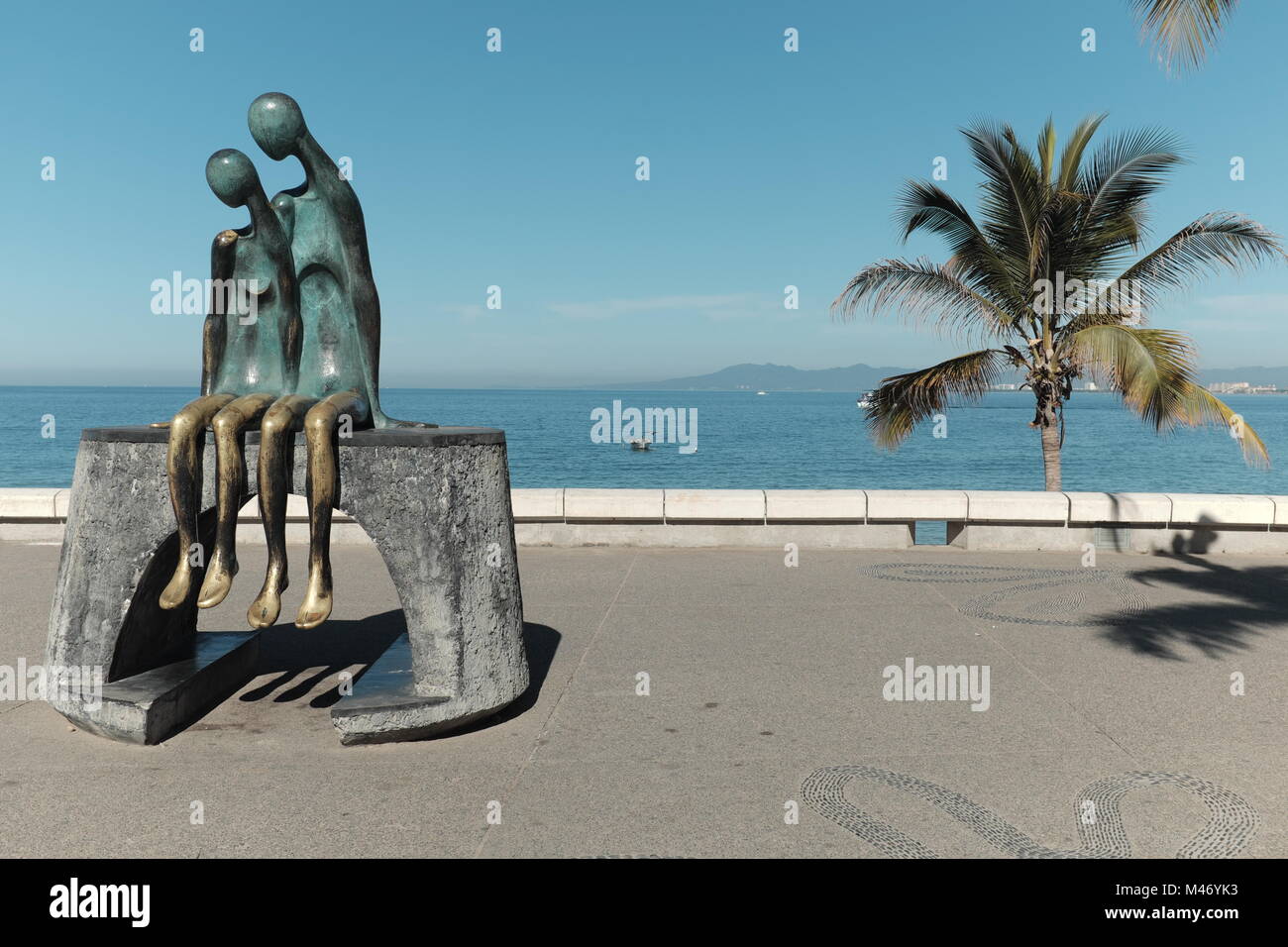 'Nostalgia' by Ramiz Barquet has been a ficture of the seaside malecon in Puerto Vallarta, Mexico since 1984. Stock Photo