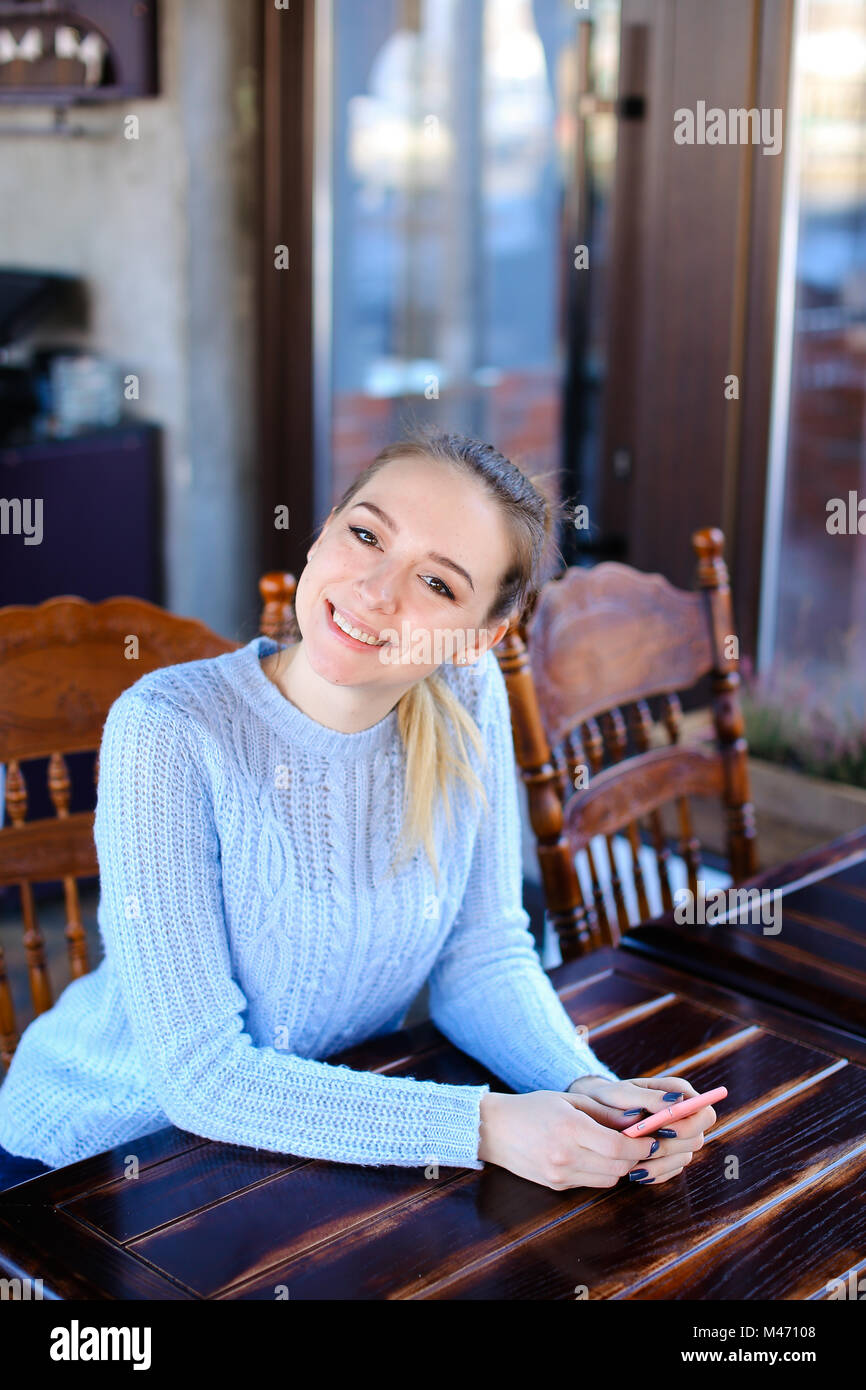 Model waiting photographer for photoshoot in cafe Stock Photo - Alamy