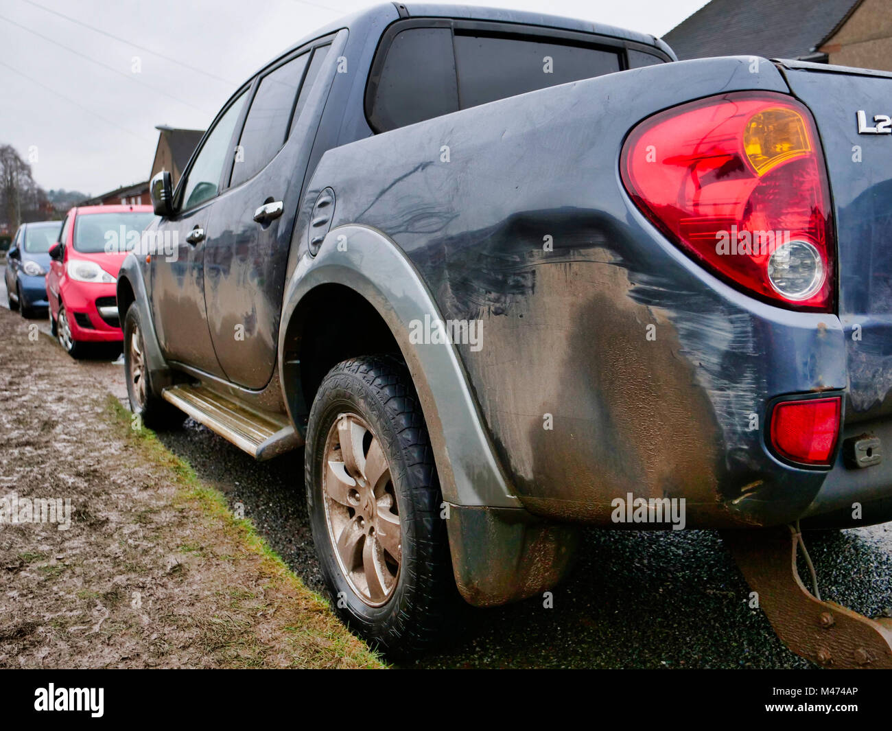 Cars damaged by the scrum during Ashbourne Royal Shrovetide hugball Football match Ash Wednesday 14th February 2018. Ye Olde & Ancient Medieval hugball game is the forerunner to football. It's played between two teams, the Up'Ards & Down'Ards separated by the Henmore Brook river. The goals are 3 miles apart at Sturston Mill & Clifton Mill. Stock Photo