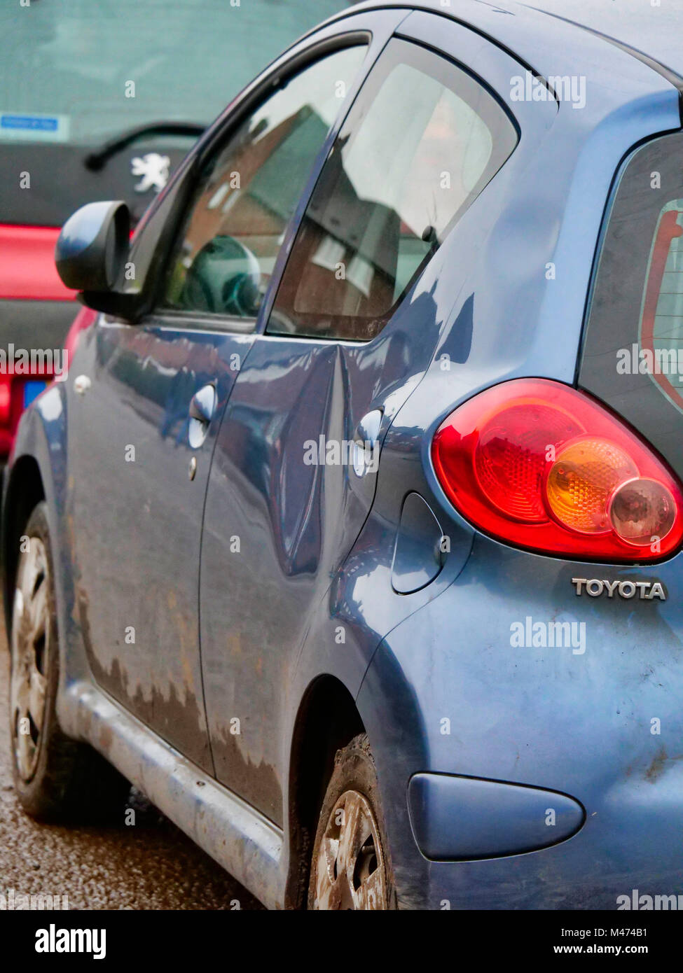 Cars damaged by the scrum during Ashbourne Royal Shrovetide hugball Football match Ash Wednesday 14th February 2018. Ye Olde & Ancient Medieval hugball game is the forerunner to football. It's played between two teams, the Up'Ards & Down'Ards separated by the Henmore Brook river. The goals are 3 miles apart at Sturston Mill & Clifton Mill. Stock Photo