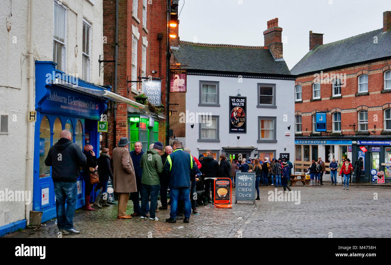 Ashbourne, UK. 14th Febraury, 2018. Celebrations, beer, fish & chips at the end of the wet two day Ashbourne Royal Shrovetide hugball Football match Shrove Ash Wednesday 14th February 2018. Ye Olde & Ancient Medieval hugball game is the forerunner to football. It's played between two teams, the Up'Ards & Down'Ards separated by the Henmore Brook river. The goals are 3 miles apart at Sturston Mill & Clifton Mill. Credit: Doug Blane/Alamy Live News Stock Photo