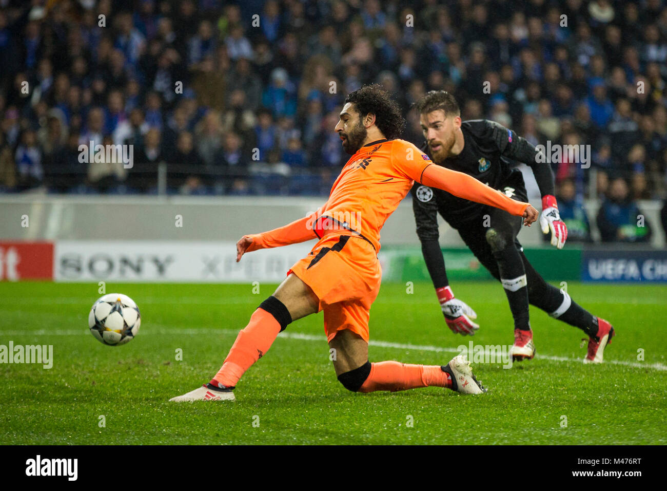 Porto, Portugal. 14th February, 2018. Liverpool FC player Mahamed Salah scores  the second goal during the UEFA CHampions League round 16 first leg 2017/18  match between FC Porto and Liverpool FC, at