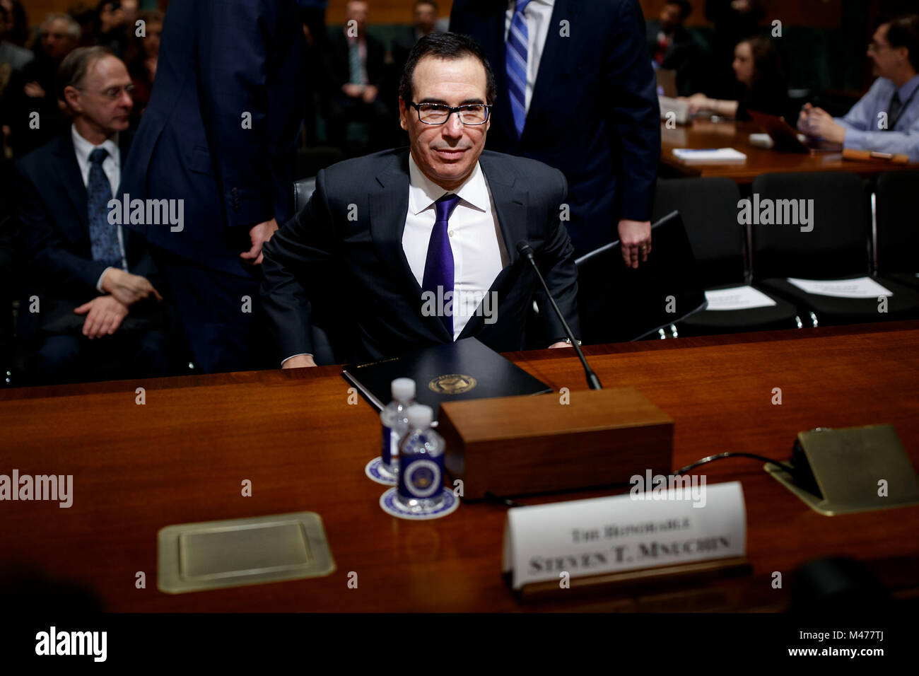 Washington, USA. 14th Feb, 2018. U.S. Treasury Secretary Steve Mnuchin arrives to testify before a Senate Finance Committee hearing regarding the budget for fiscal year 2019 at the Capitol in Washington, DC, United States, on Feb. 14, 2018. Credit: Ting Shen/Xinhua/Alamy Live News Stock Photo