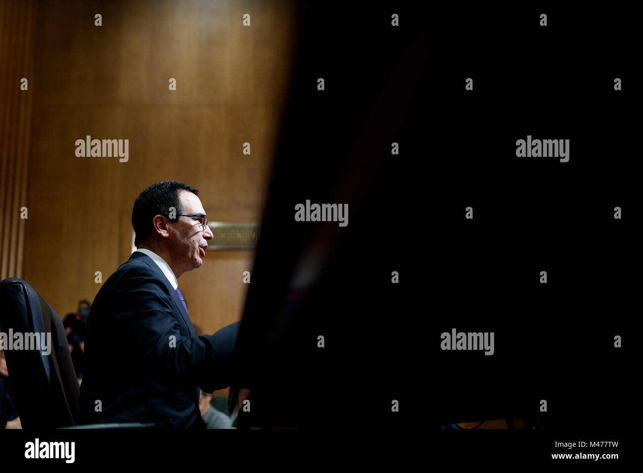 Washington, USA. 14th Feb, 2018. U.S. Treasury Secretary Steve Mnuchin testifies before a Senate Finance Committee hearing regarding the budget for fiscal year 2019 at the Capitol in Washington, DC, United States, on Feb. 14, 2018. Credit: Ting Shen/Xinhua/Alamy Live News Stock Photo