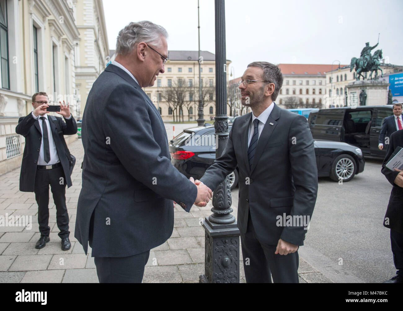 Munich, Germany. 15th Feb, 2018. Joachim Herrmann (CSU, L), Minister of Interior of the state of Bavaria, receiving Herbert Kickl (FPO), Austrian Minister of Interior, during the latter's inaugural visit to Munich, Germany, 15 February 2018. Credit: Lino Mirgeler/dpa/Alamy Live News Stock Photo