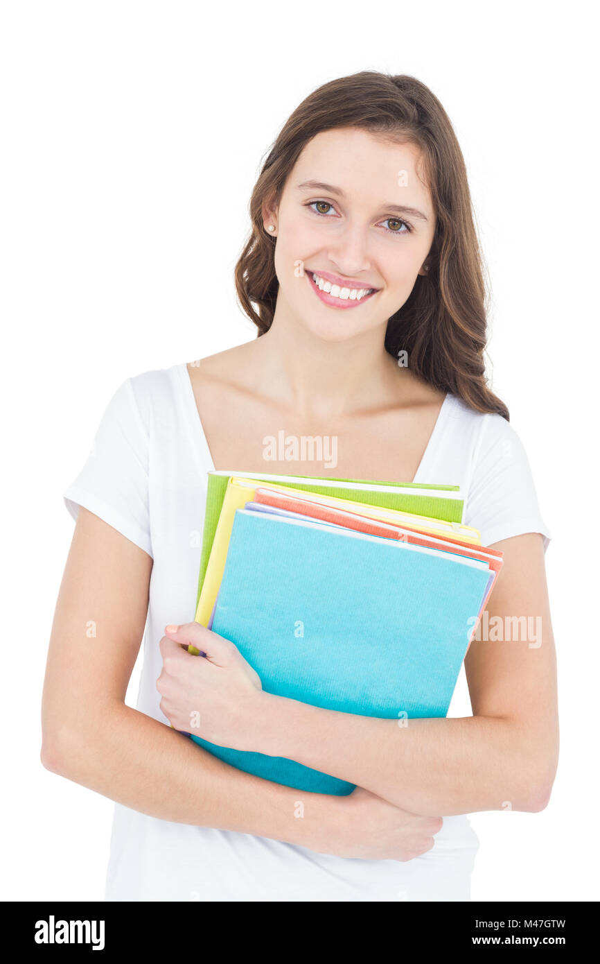 Cheerful female student holding books hi-res stock photography and ...