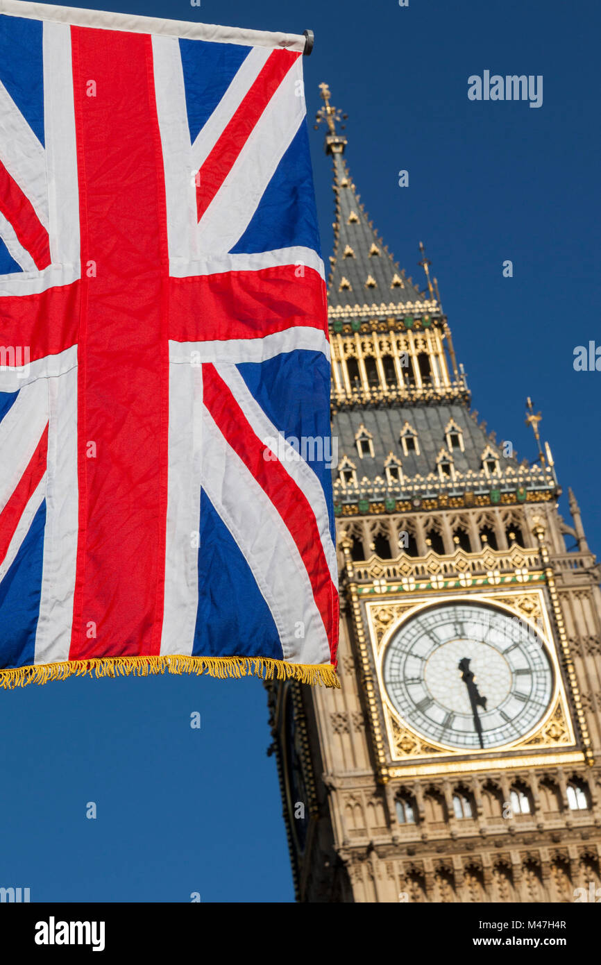 Large Union Jack, Union Flag, flying in front of the iconic landmark Big Ben, London, England, United Kingdom Stock Photo