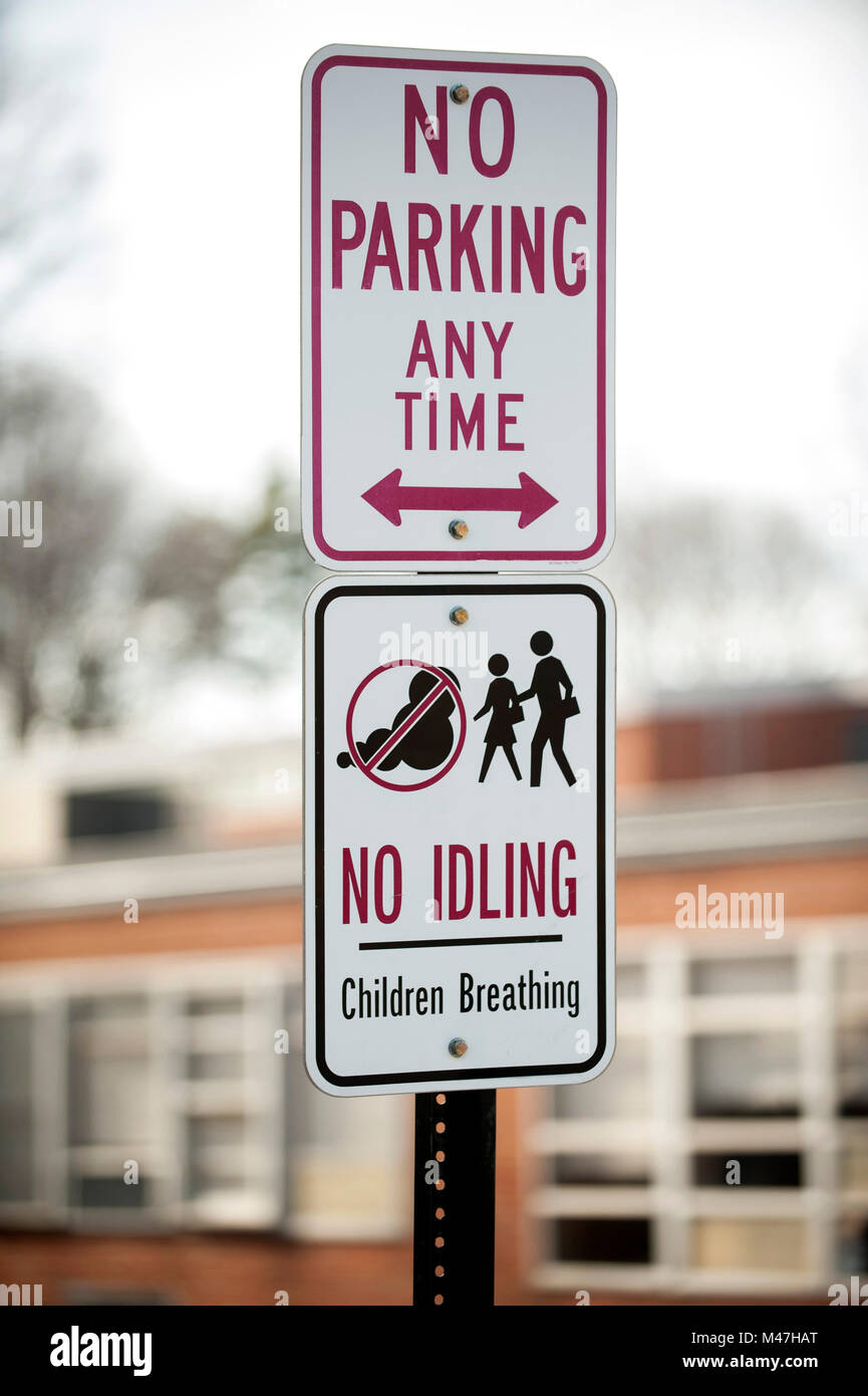 Signs outside of school prohibiting car idling Stock Photo