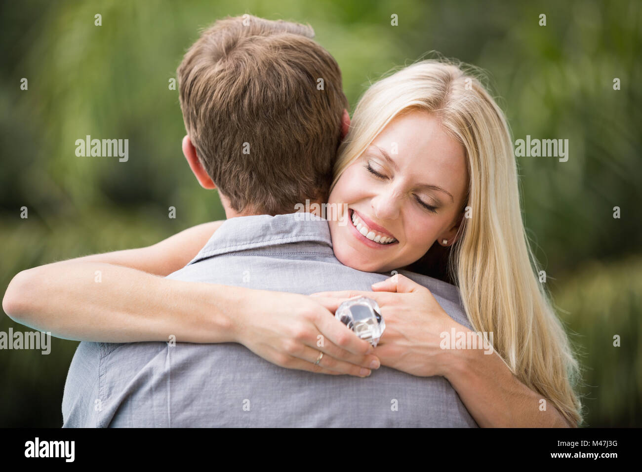 Stylish man hugging smiling hi-res stock photography and images - Alamy