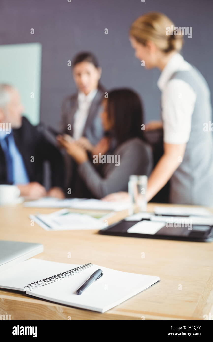 Organizer with pen on table in conference room Stock Photo Alamy