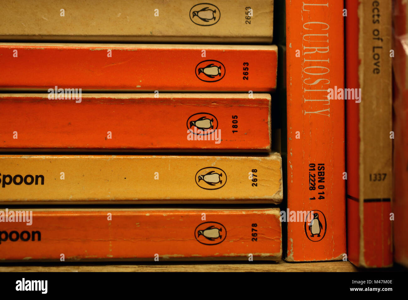 A selection of old Penguin Orange Books in an old bookshop in Bognor Regis, West Sussex, UK. Stock Photo