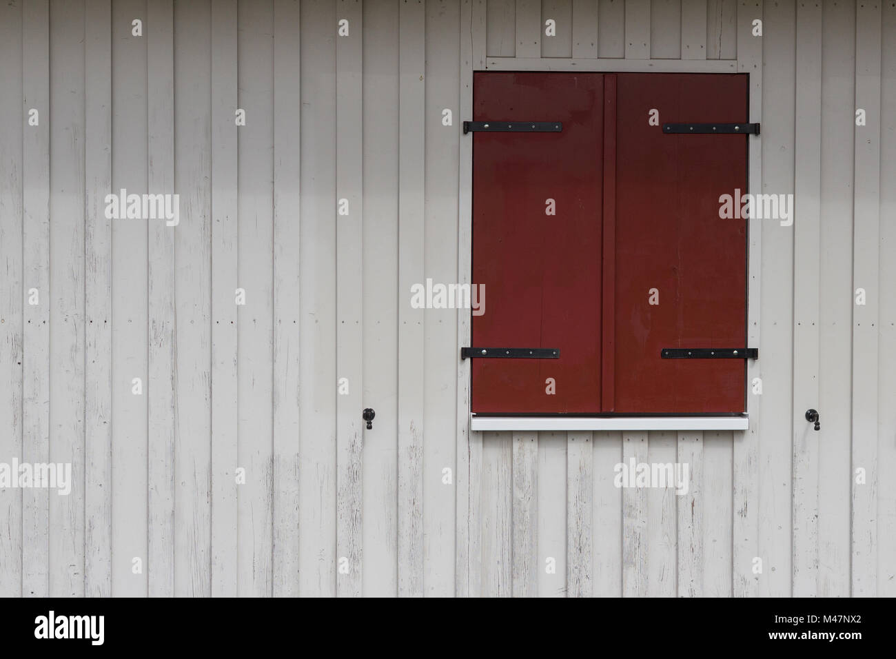 rural building exterior - wooden shutters on wooden wall Stock Photo