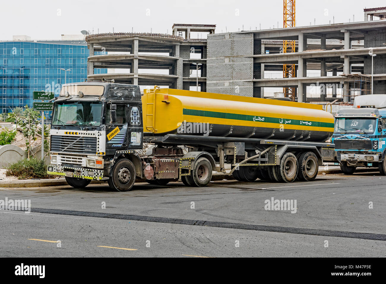 Jeddah water truck. One of many trucks in Jeddah used to transport water to houses, apartments and worksites. Potable water comes from desalination. Stock Photo