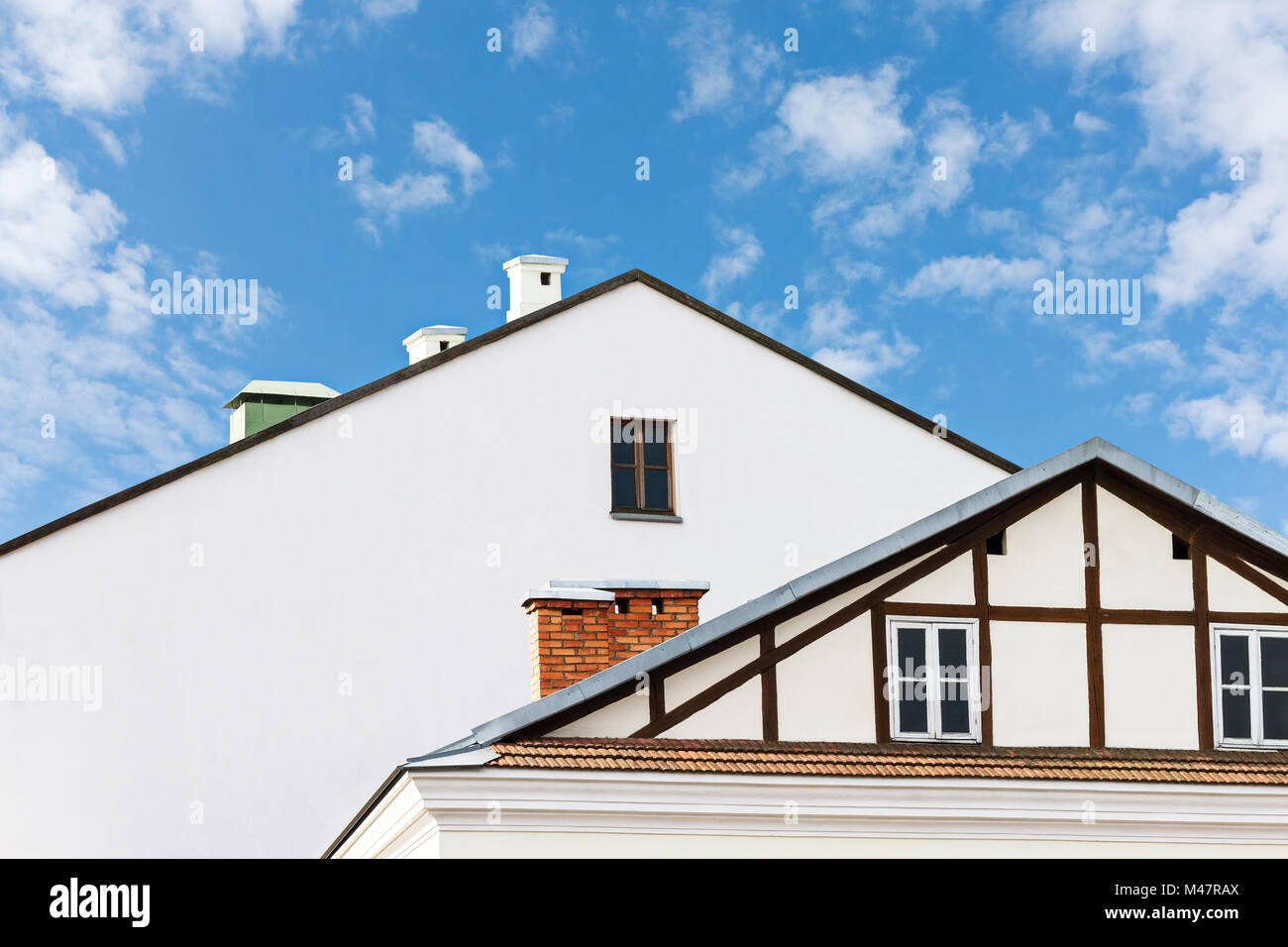 roofs of residential buildings against blue sky Stock Photo