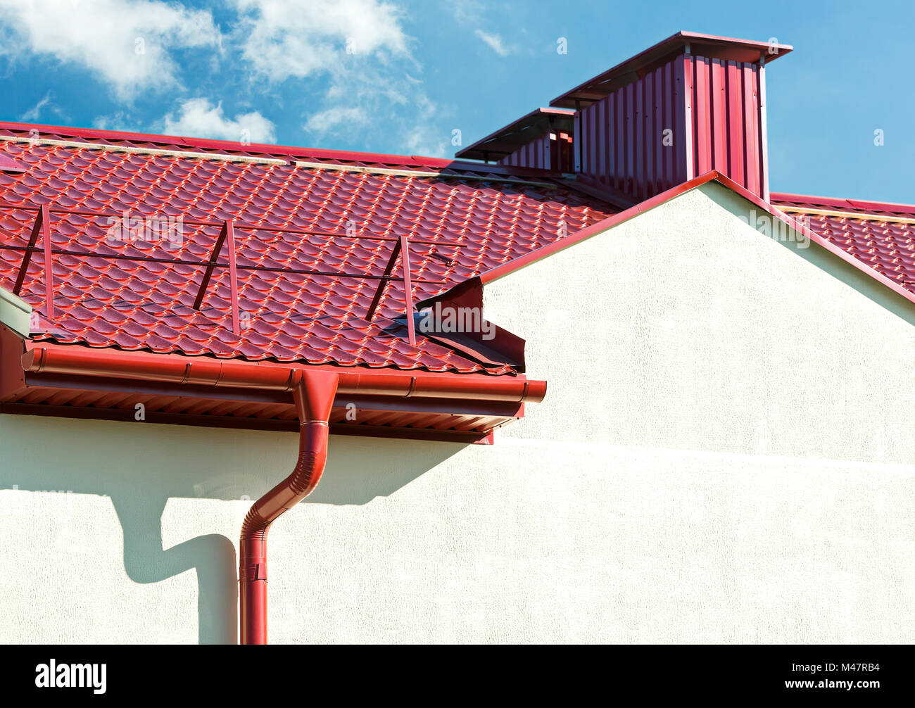 new red tiled roof with gutter Stock Photo