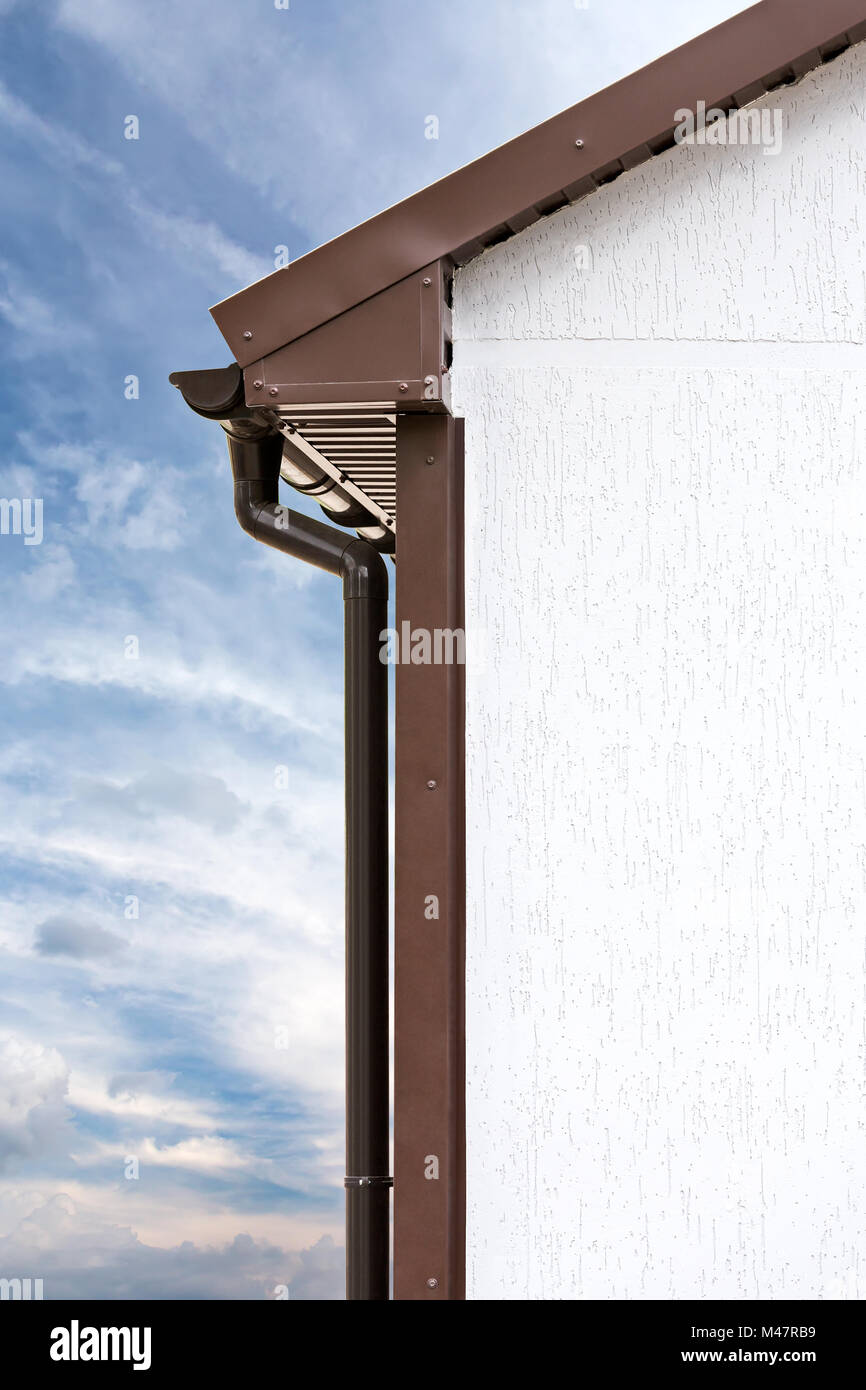 plastic rain gutters on a home Stock Photo