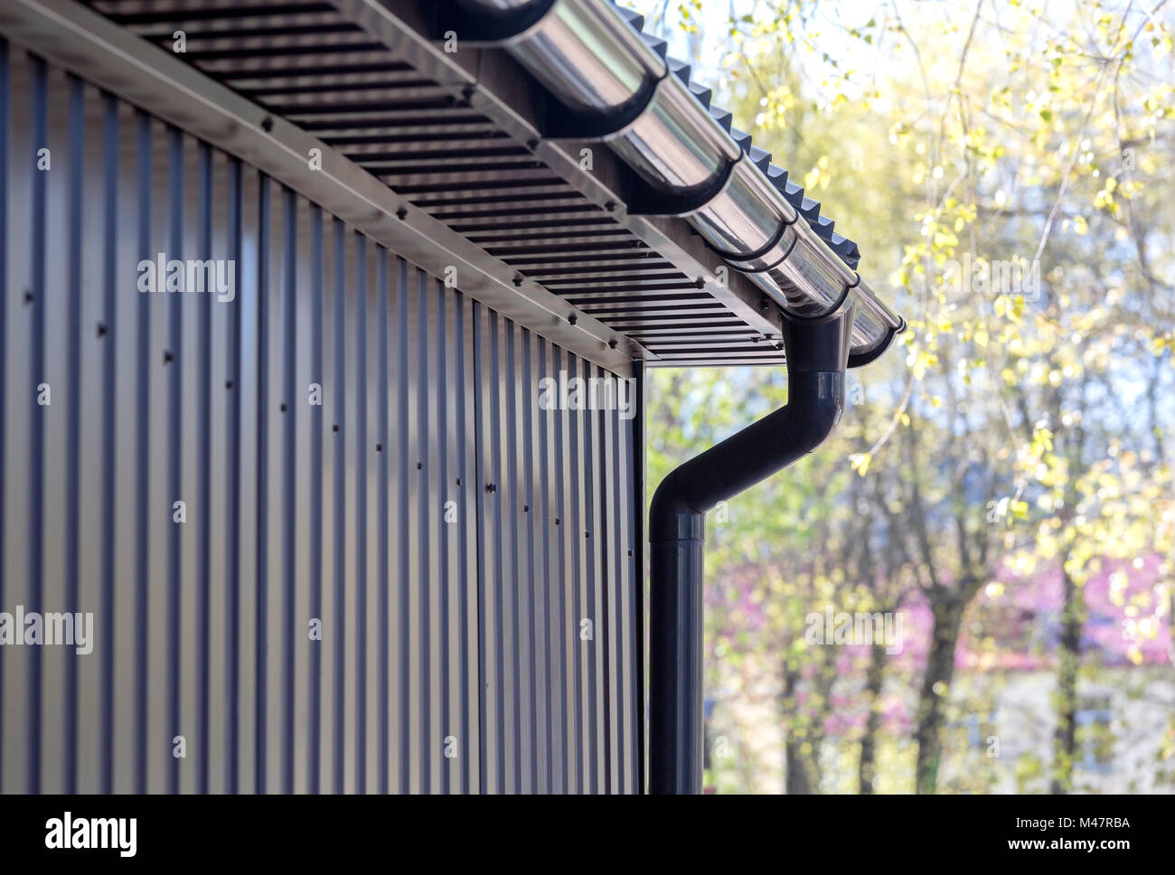 brown plastic downspout Stock Photo