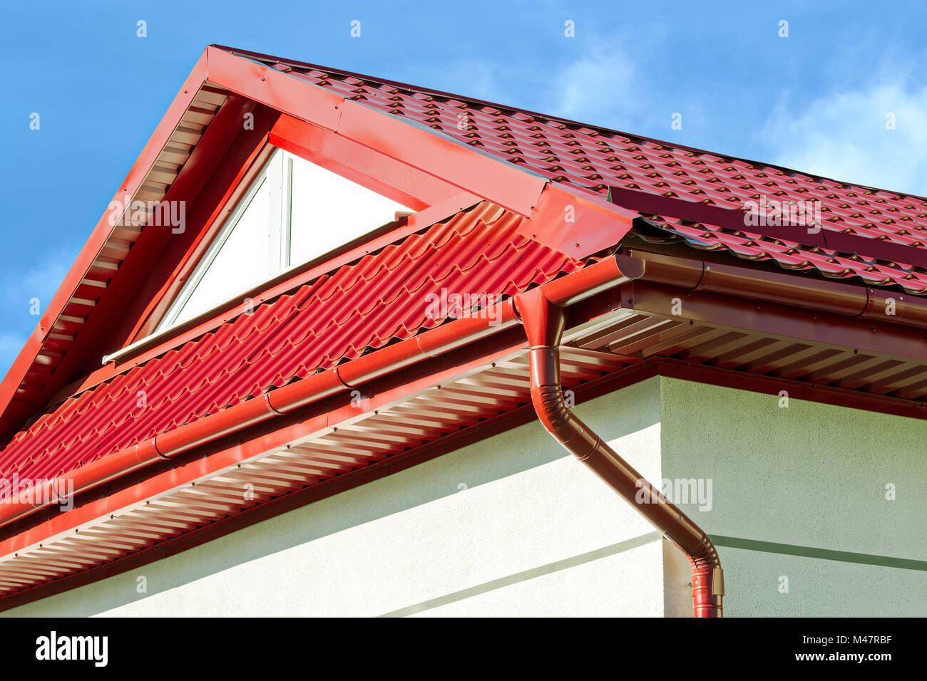 new red tiled roof with gutter Stock Photo