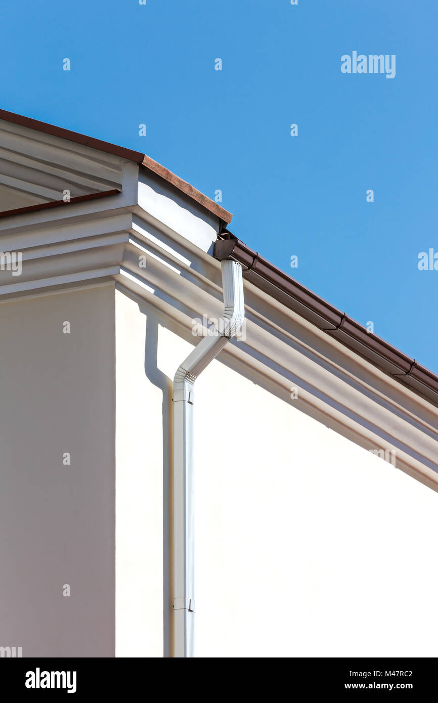 white metal roof gutter Stock Photo