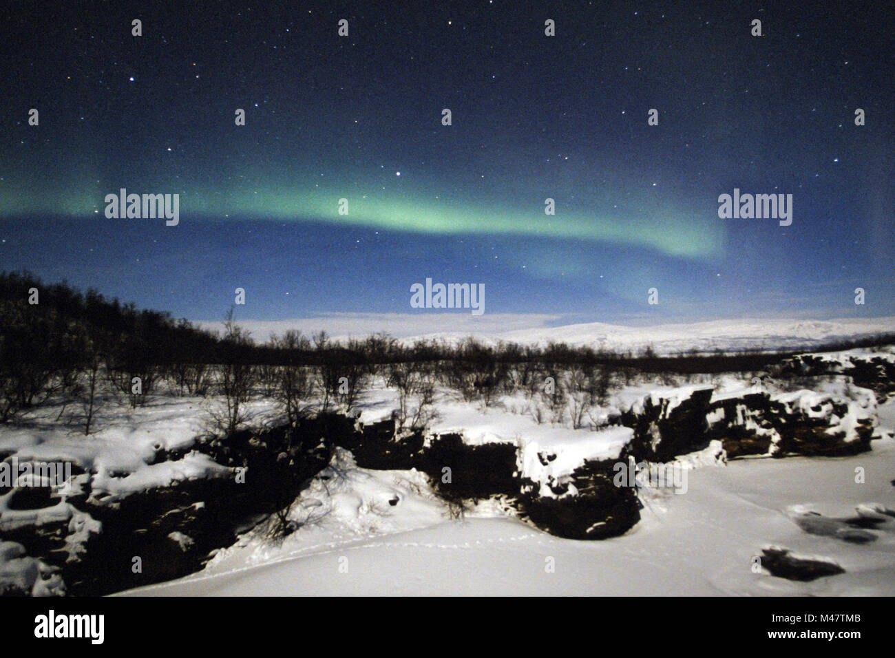 Abiskojakka-Canyon and Northern Lights in winter Stock Photo