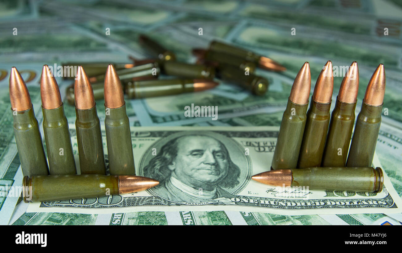Money and Ammo - illegal trading Stock Photo