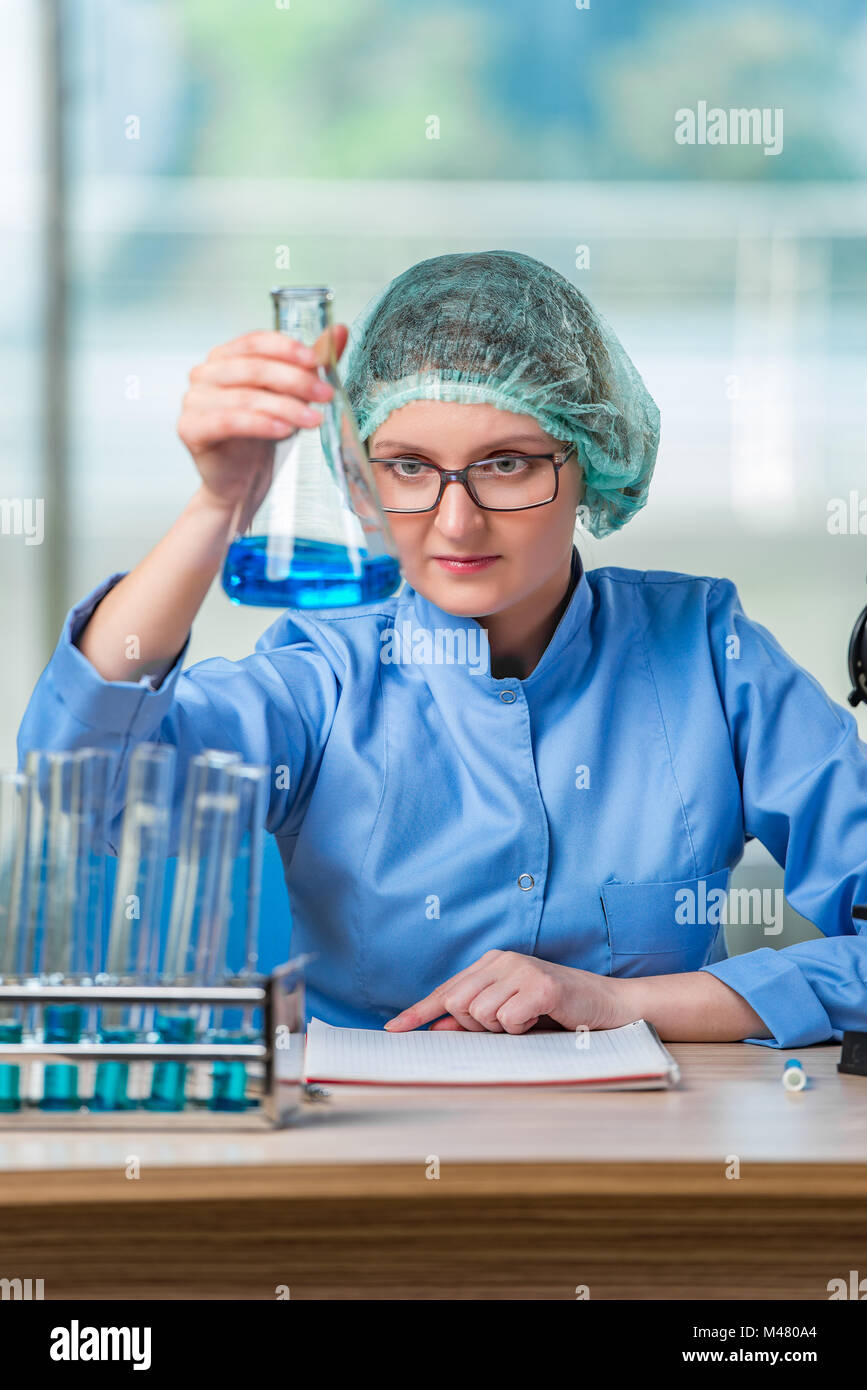 Experienced lab assistant working on chemical solutions Stock Photo Alamy