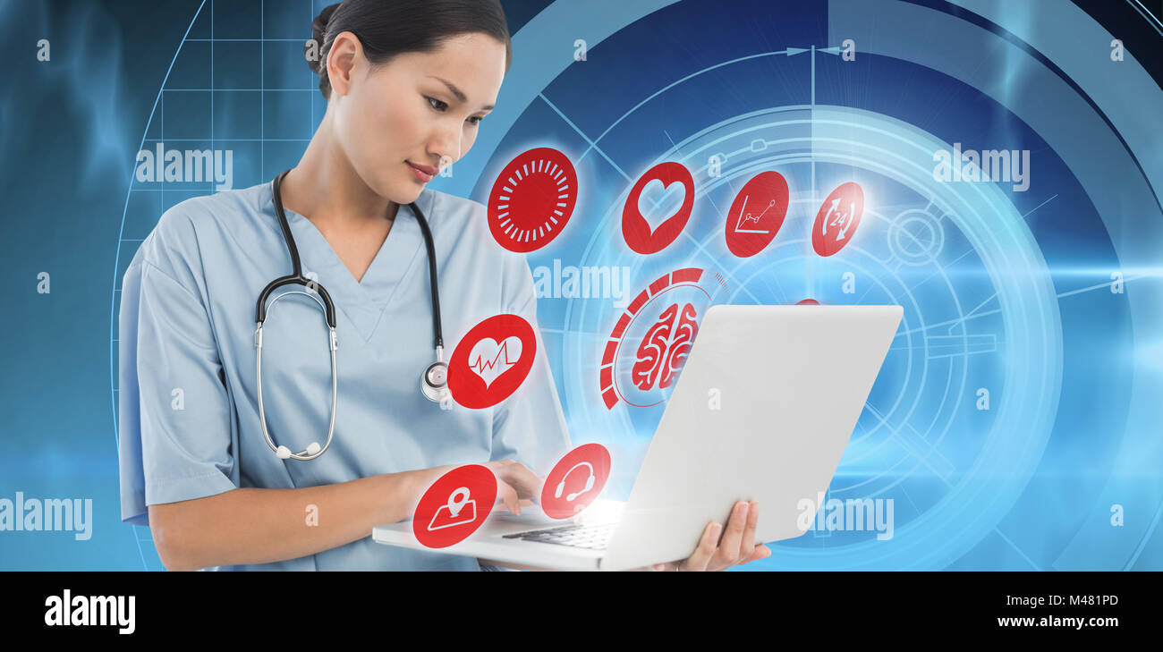 Composite image of concentrated surgeon using a laptop in hospital Stock Photo