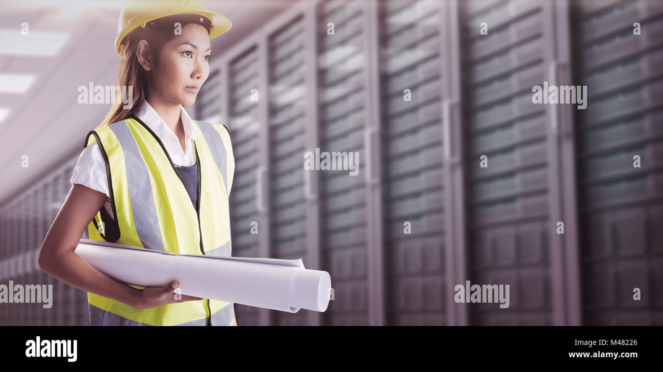 Composite image of architect woman with yellow helmet and plans Stock Photo