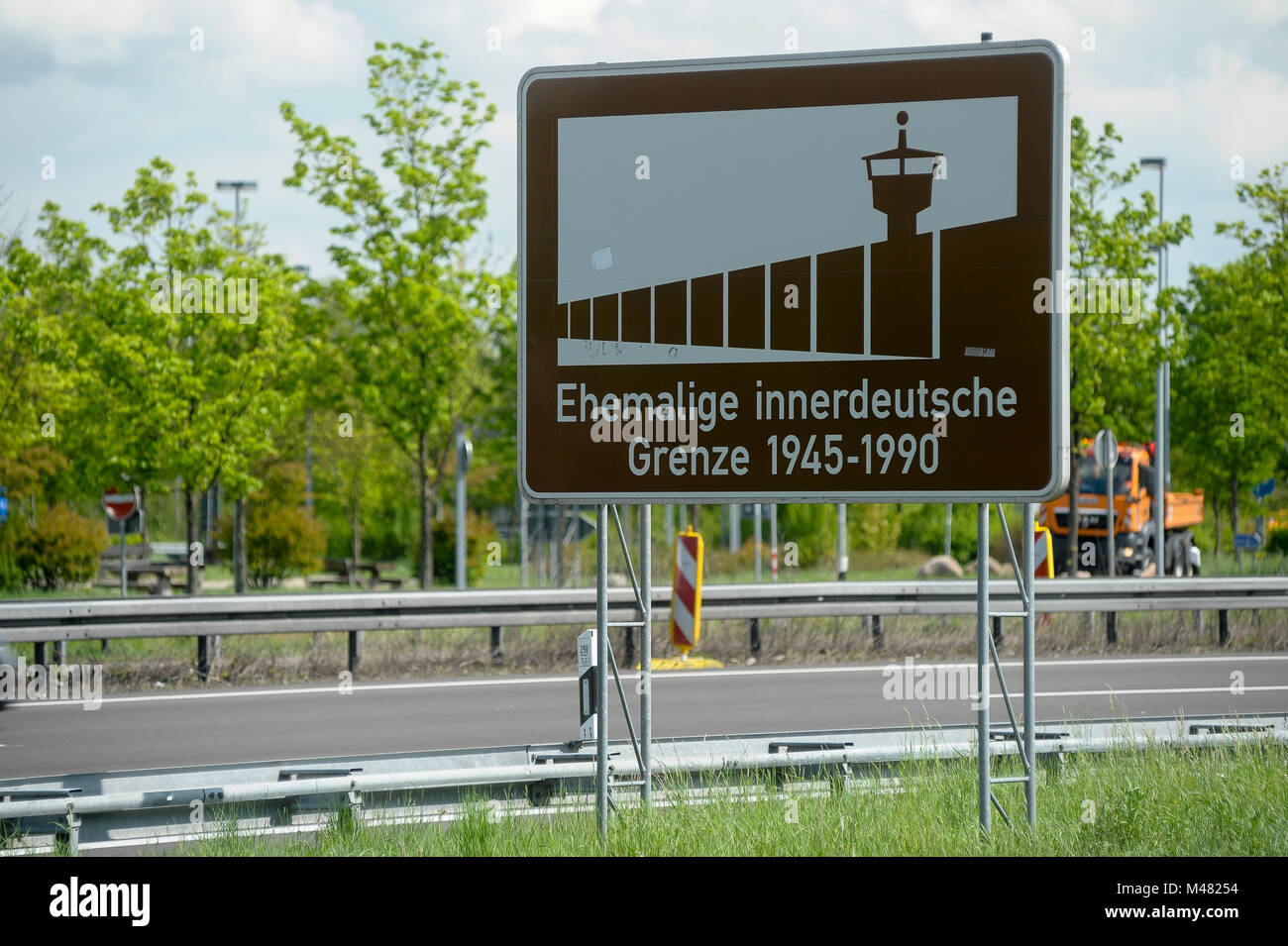 Road sign on West German side of the former DDR (Grenzubergangsstelle Marienborn GUSt) and West German (Grenzubergang Helmstedt Marienborn) border cro Stock Photo