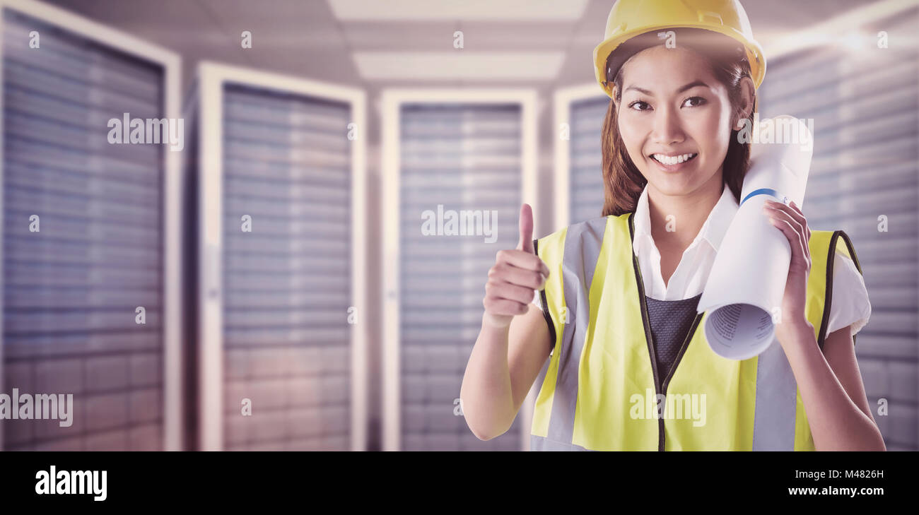 Composite image of architect woman with thumbs up Stock Photo