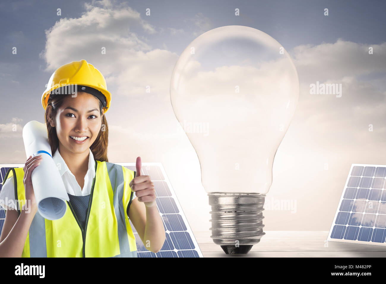 Composite image of architect woman with thumbs up Stock Photo