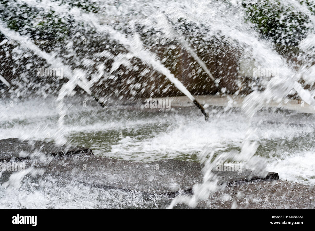 Waterspout fountain in the park Planten un Blomen in Hmaburg during daylight with blurred water. Stock Photo