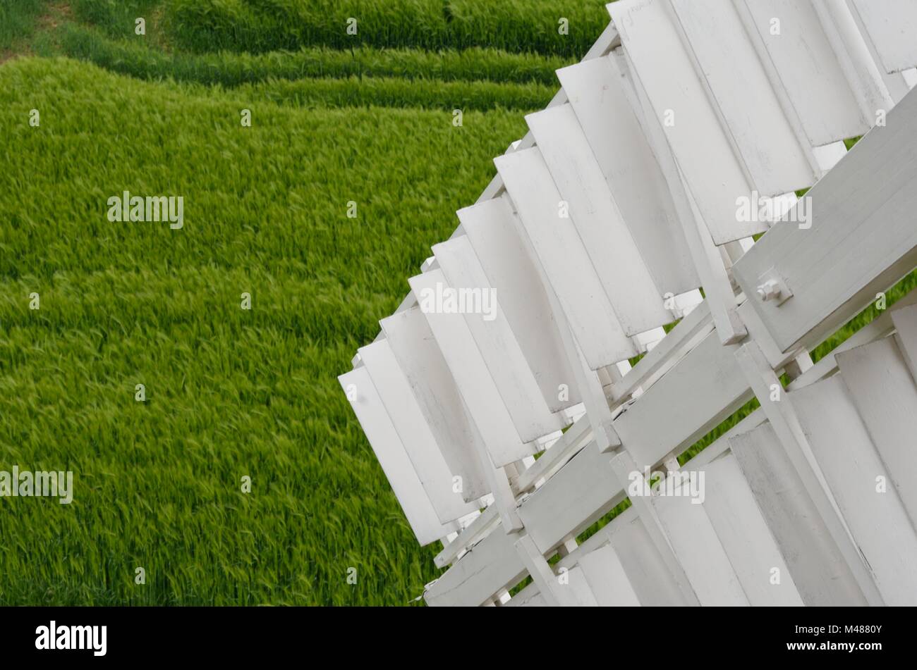 Detail of sail of window with field in background Stock Photo