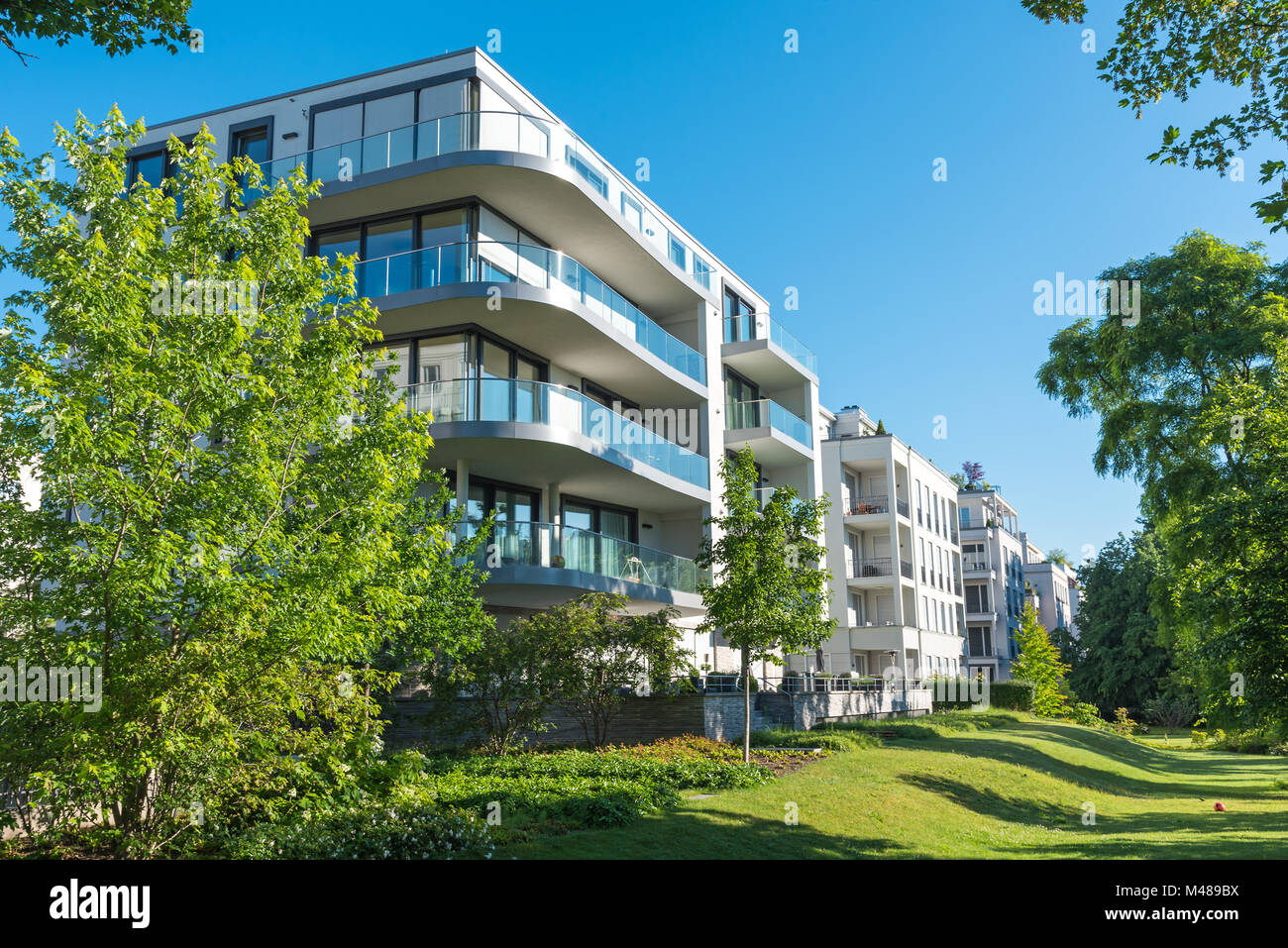 Modern apartment houses with garden seen in Berlin, Germany Stock Photo
