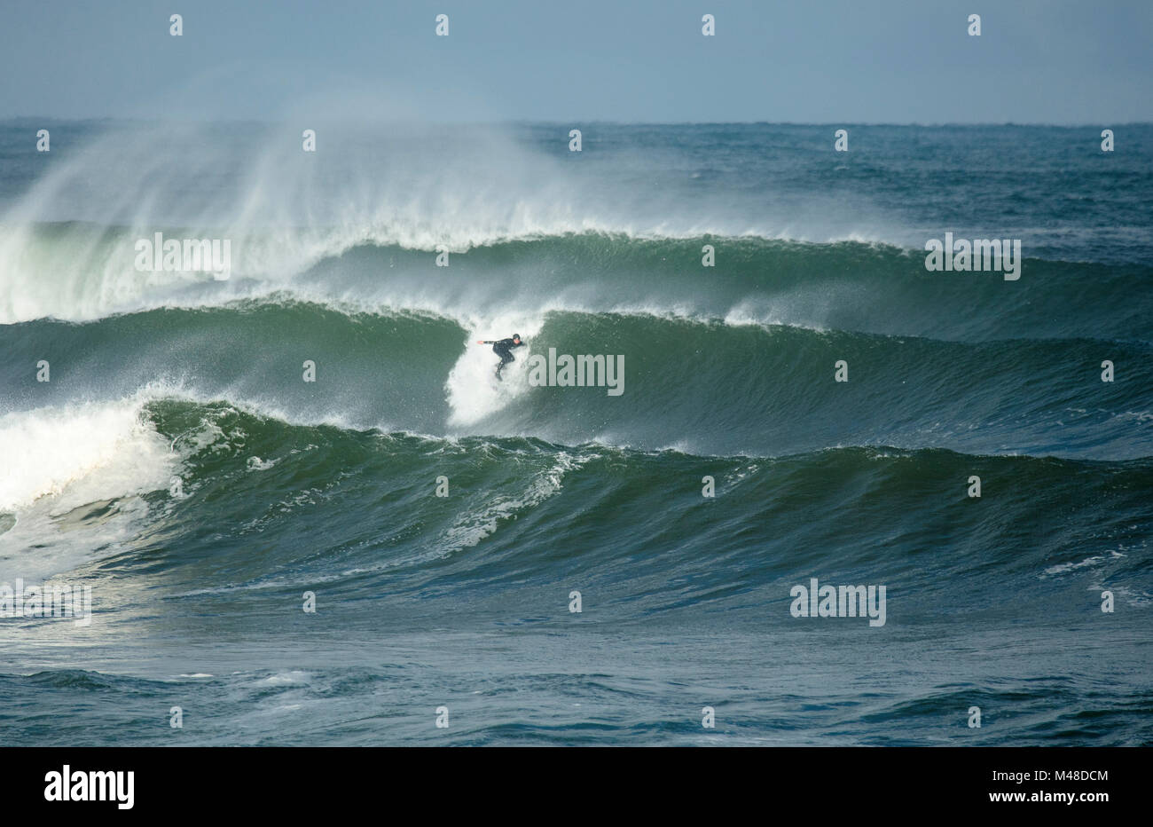 Surfer riding a wave at Easky, County Sligo, Ireland. Stock Photo