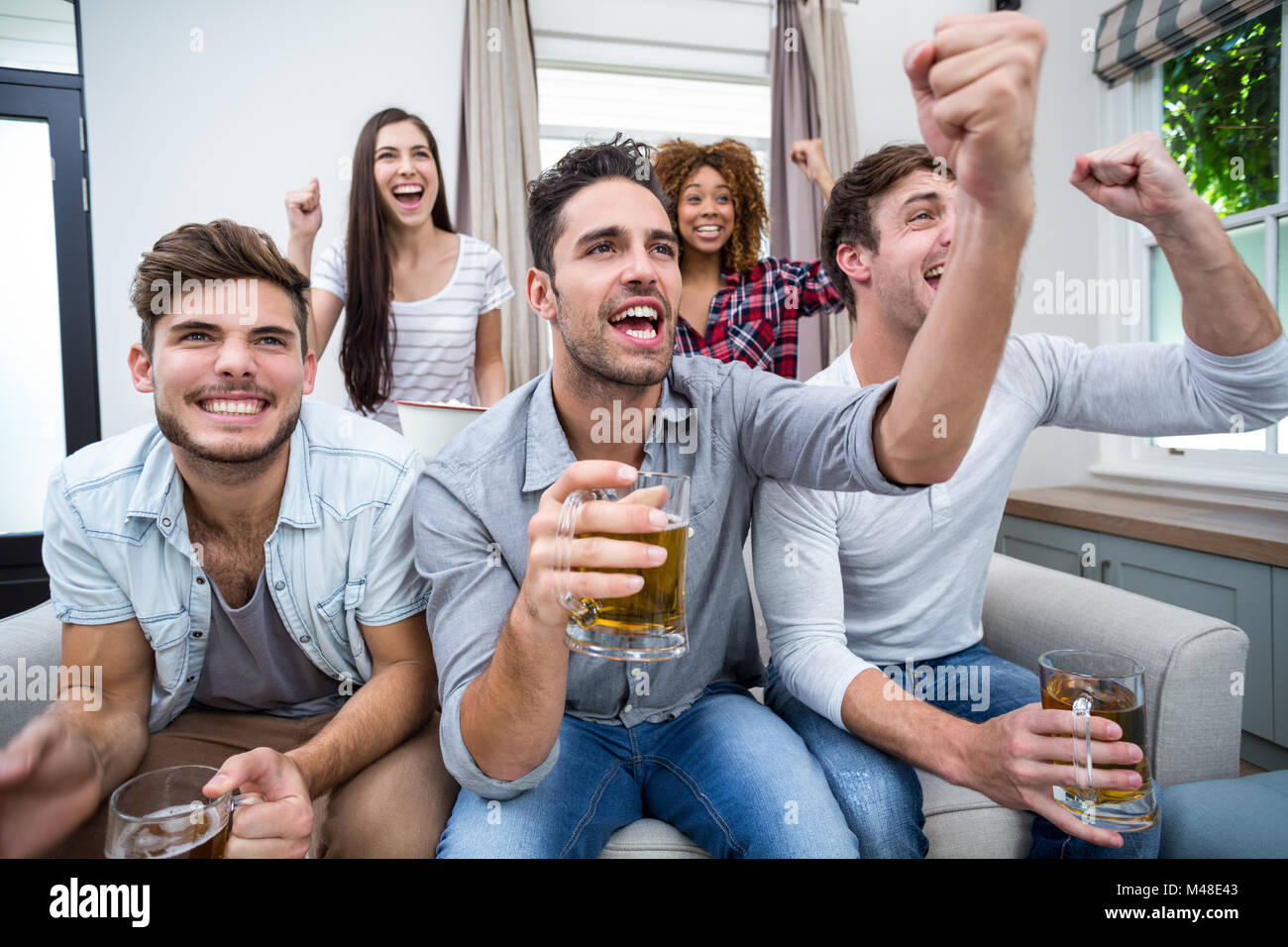 Soccer tv cheering hi-res stock photography and images - Alamy