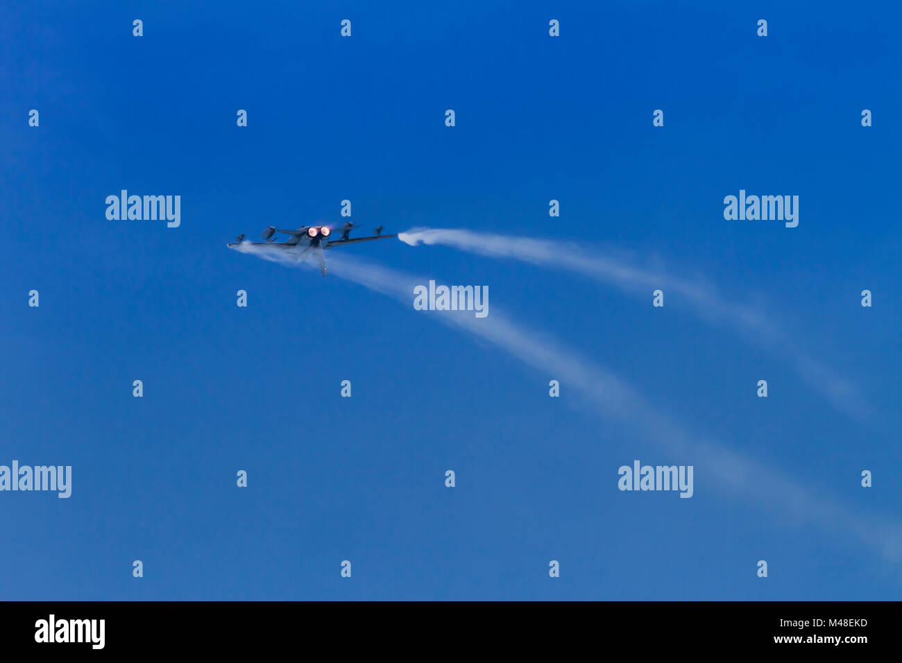 A Royal Air Force Tornado GR4 in a high speed loop with afterburners and vortices Stock Photo