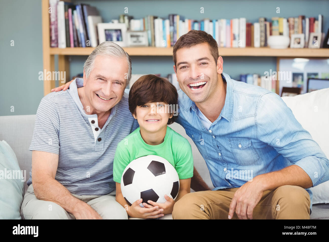 Portrait of happy multi genration family with football Stock Photo - Alamy