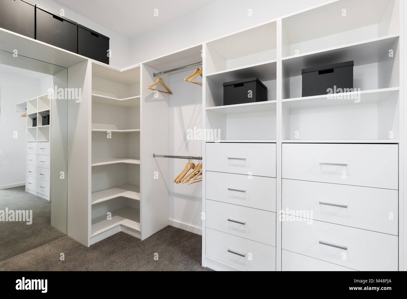 Large walk in wardrobe cabinetry detail in new home Stock Photo