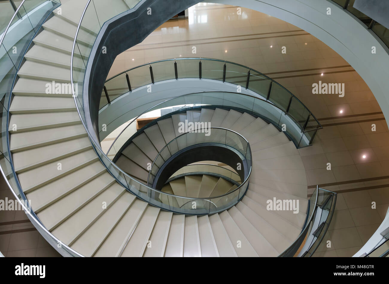 Kuala Lumpur, Malaysia - November 10, 2015: Modern spiral staircase in Sasana Kijang, Kuala Lumpur, Malaysia - contemporary interior spiral staircase  Stock Photo