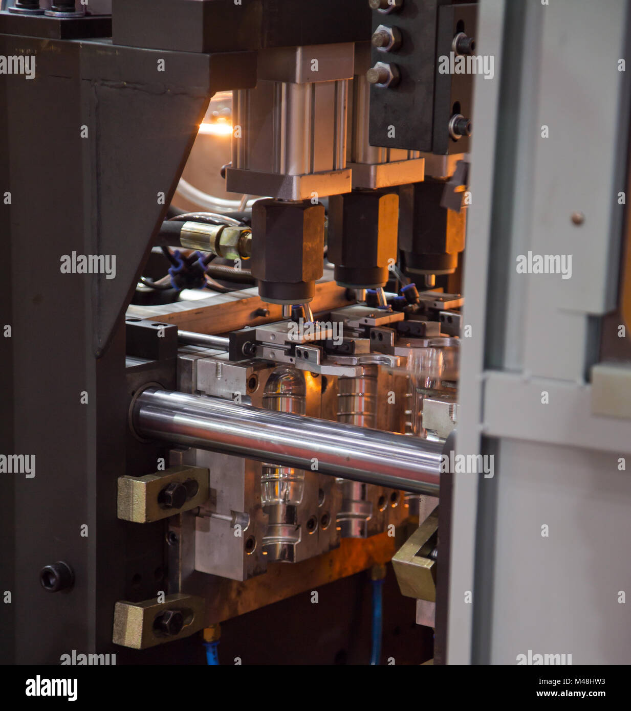 Heating process for plastic bottle blowing machine Stock Photo Alamy