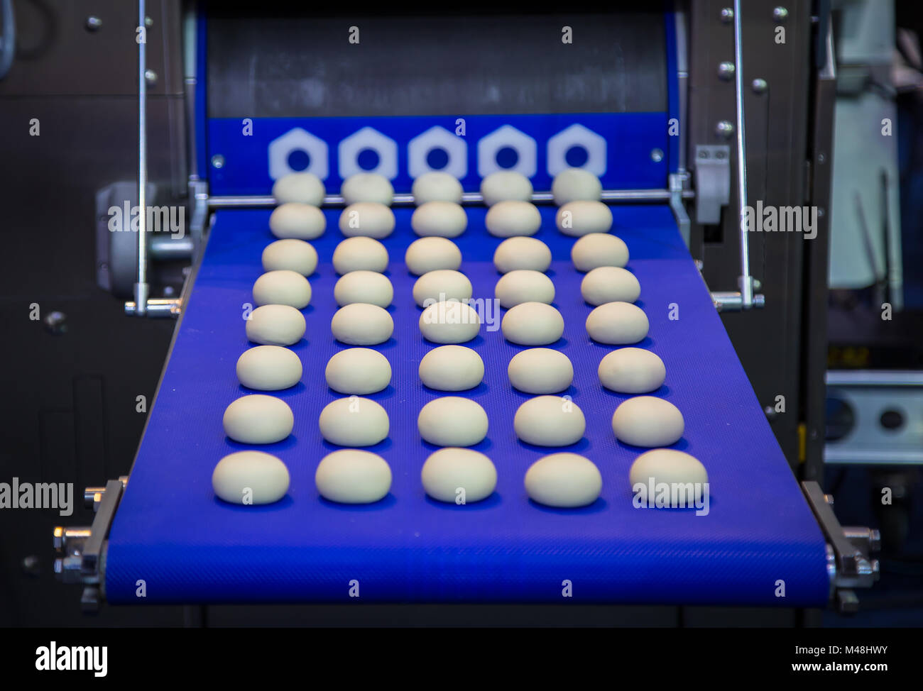 Dough divider and rounder dough ball making machine Stock Photo Alamy