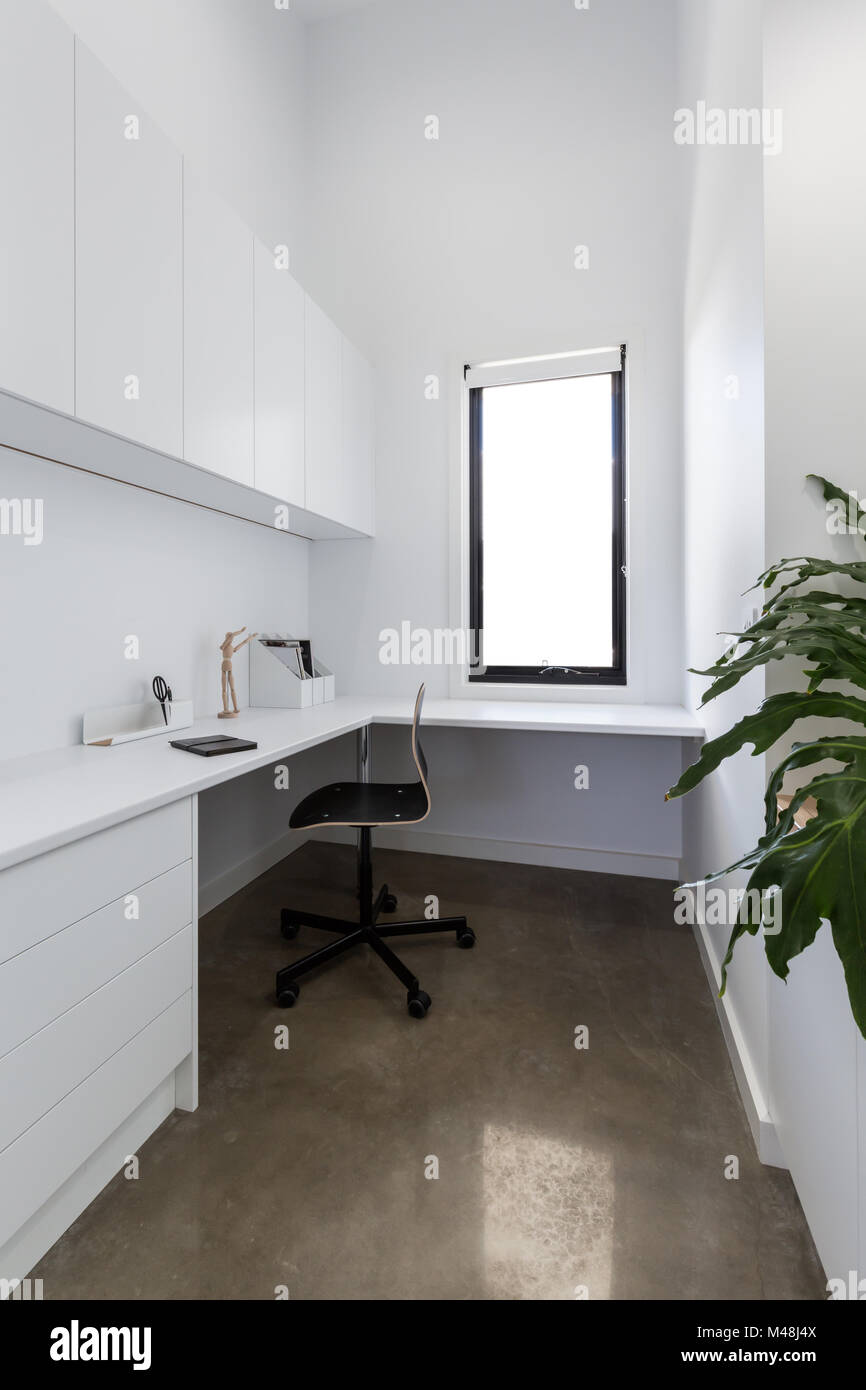 Clean crisp white study area in a contemporary home Stock Photo